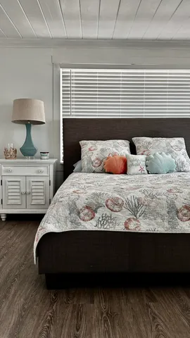 a bathroom with a bathtub and next to a window