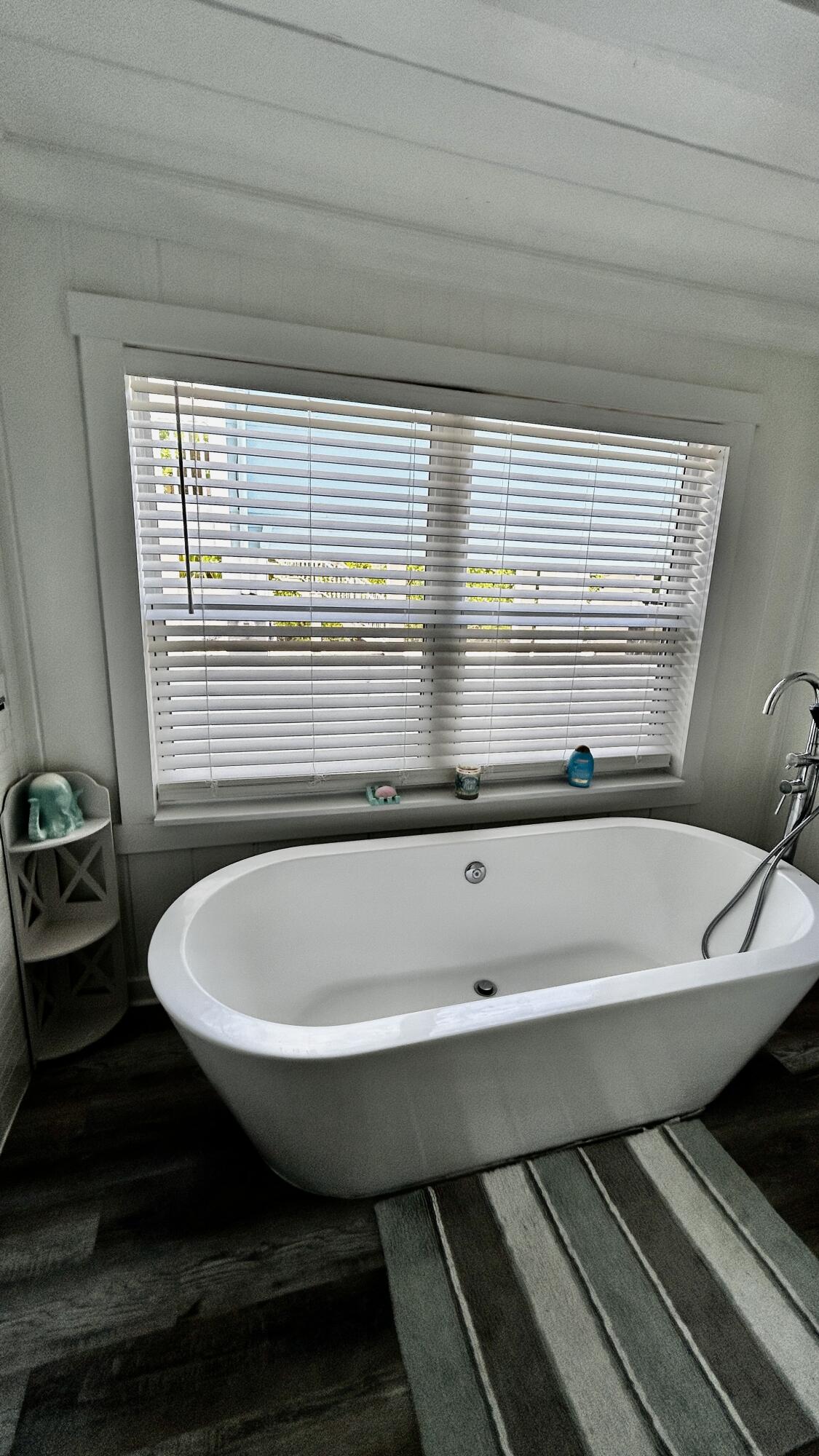 124 South Bay Harbor Drive Key Largo, FL 33037 - Photo 24 of 43 a bathroom with a bathtub and next to a window