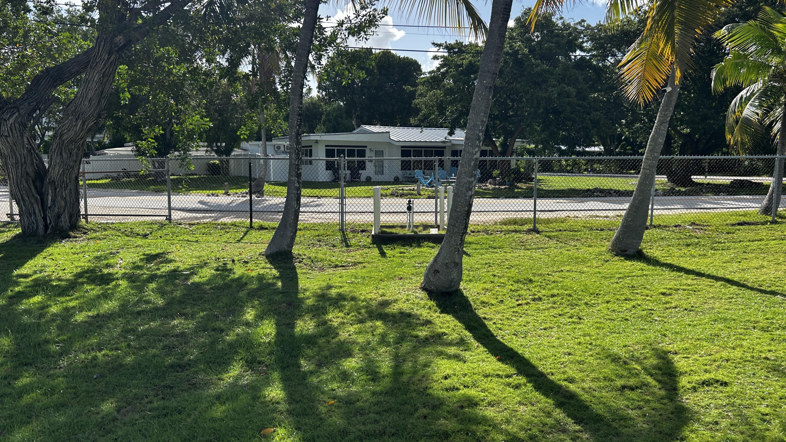 124 South Bay Harbor Drive Key Largo, FL 33037 - Photo 41 of 43 a view of a park with swings