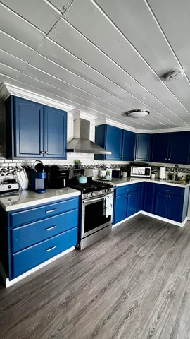 a kitchen with a stove and a microwave
