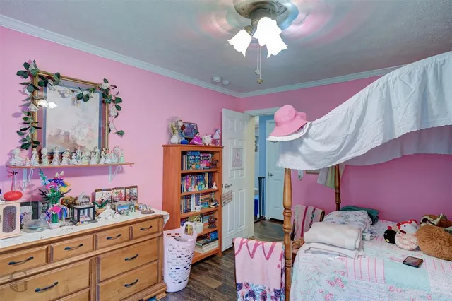 a bedroom with furniture and a chandelier