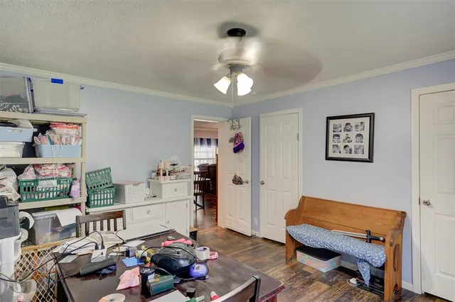 a room with furniture and a bookshelf