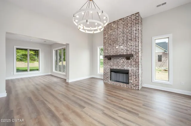 a view of kitchen with cabinets and wooden floor