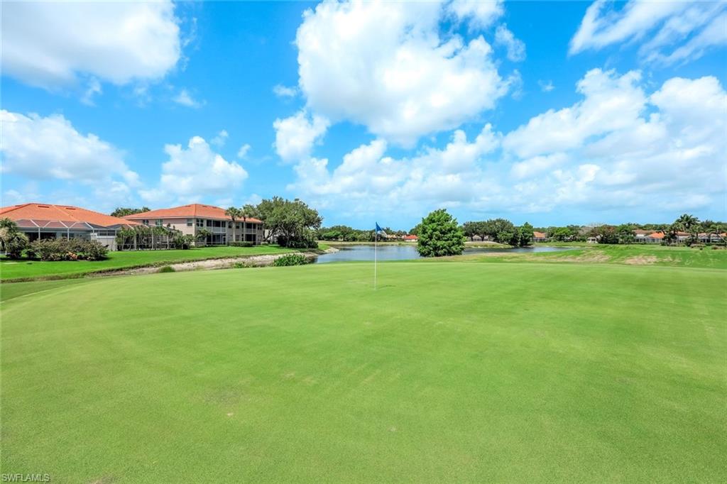 2033 Crestview Way, Unit 104 Naples, FL 34119 - Photo 19 of 24 a view of an outdoor space and a yard