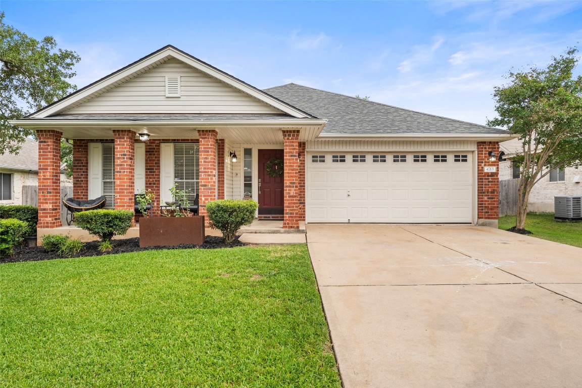 4713 Ramies Run Austin, TX 78749 - Photo 1 of 1 a front view of a house with a yard and garage