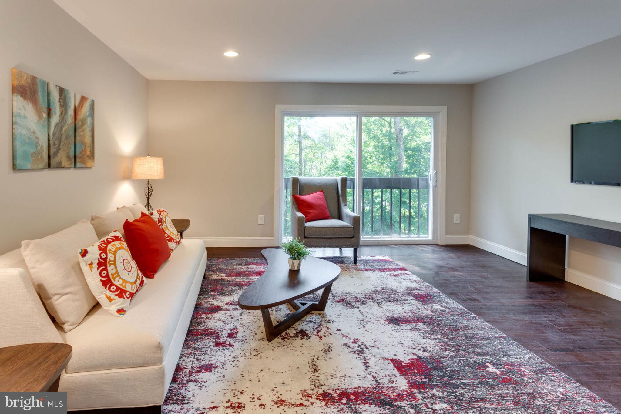 2349 Southgate Square Reston, VA 20191 - Photo 14 of 30 a living room with furniture a fireplace and a flat screen tv