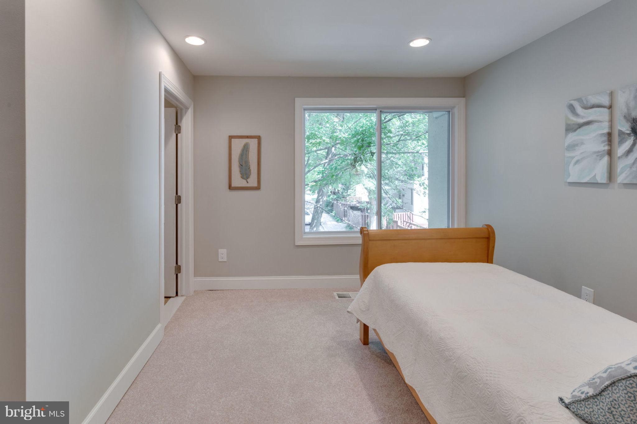 2349 Southgate Square Reston, VA 20191 - Photo 16 of 30 a bedroom with a large bed and a window