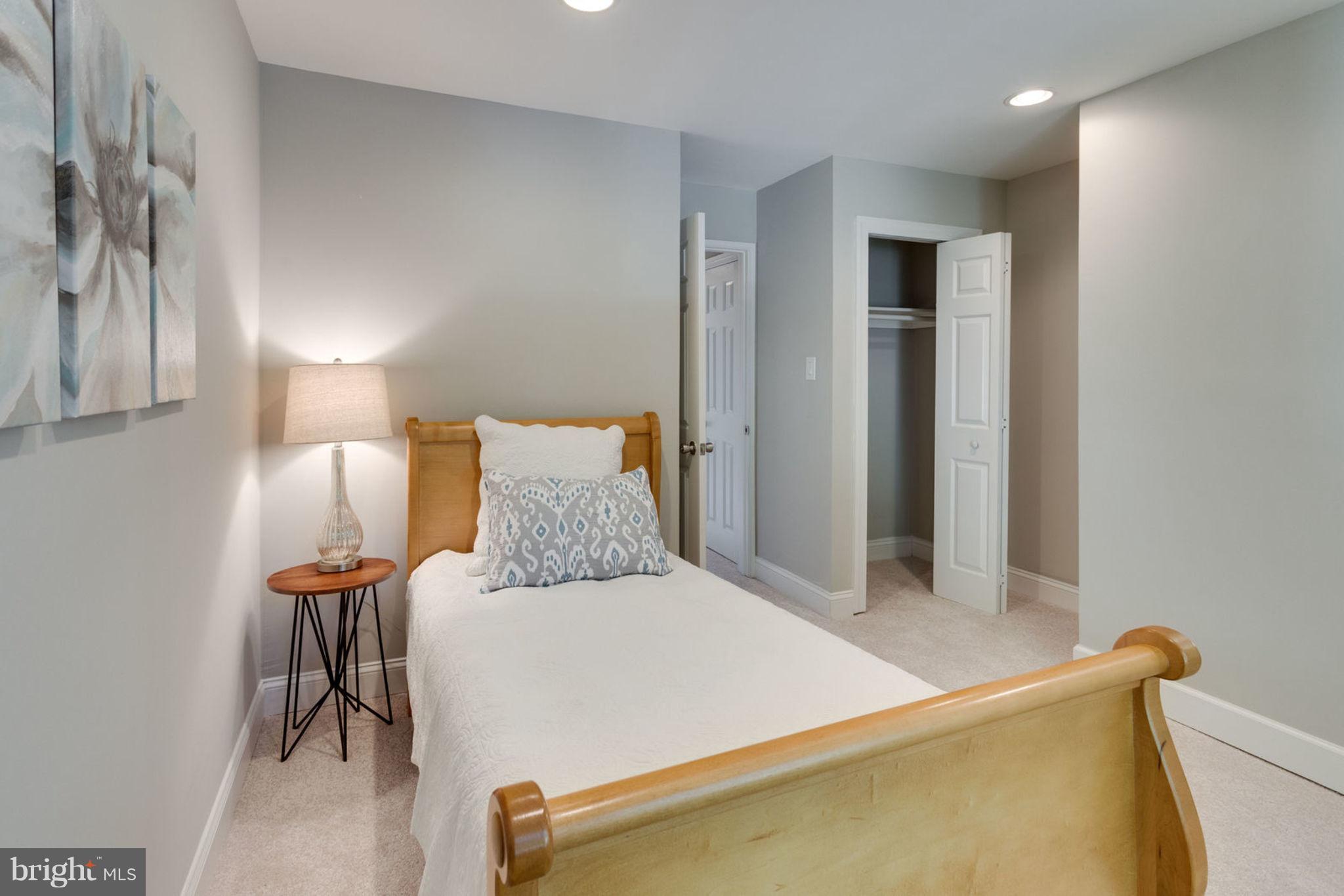 2349 Southgate Square Reston, VA 20191 - Photo 17 of 30 a bedroom with a bed and lamp