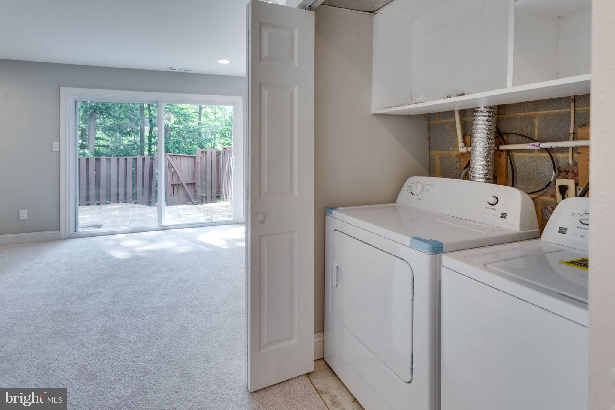 2349 Southgate Square Reston, VA 20191 - Photo 28 of 30 a view of storage and utility room with washer and dryer