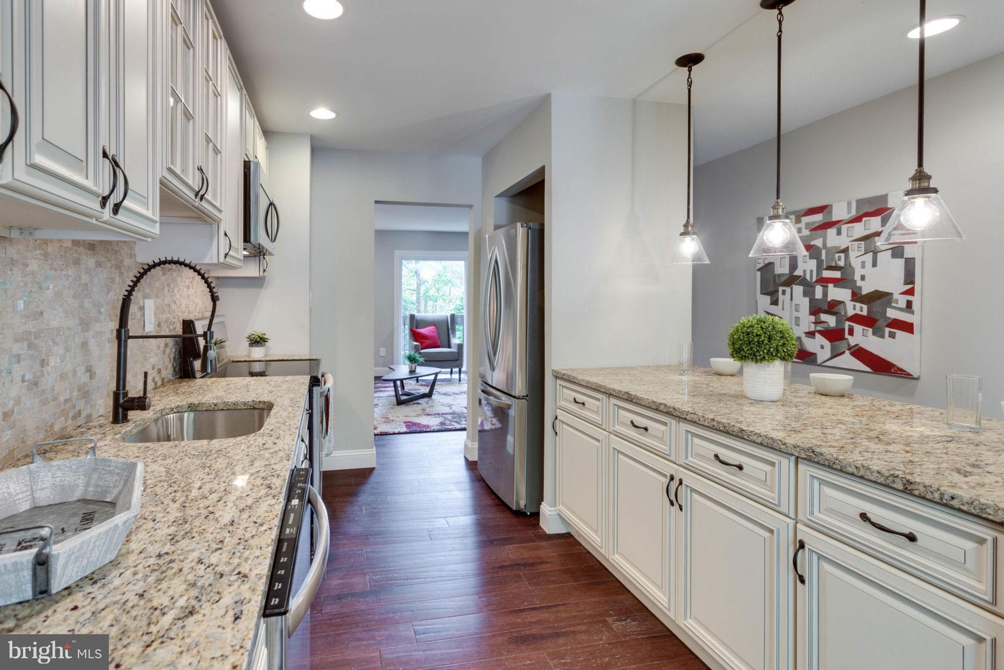 2349 Southgate Square Reston, VA 20191 - Photo 10 of 30 a kitchen with sink stove and refrigerator