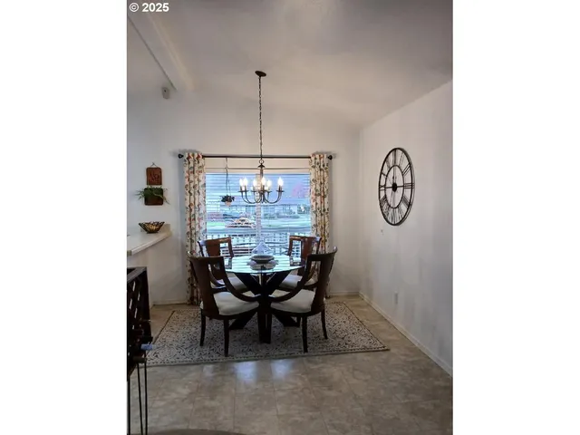 a view of a dining room with furniture and window