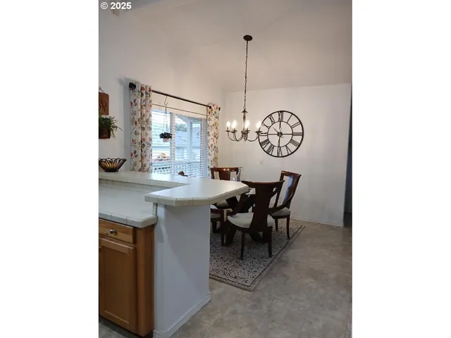 a dining room with a table and chairs