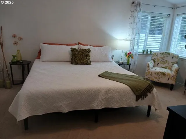 a bedroom with a bed and window