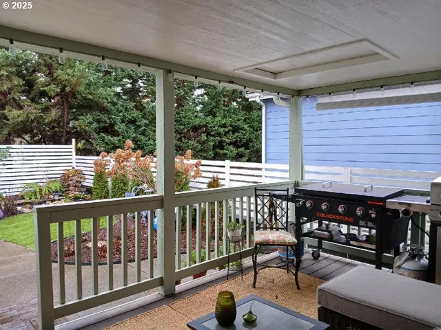 a view of a two chairs in the balcony