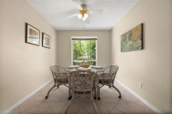 a dining room with furniture and window