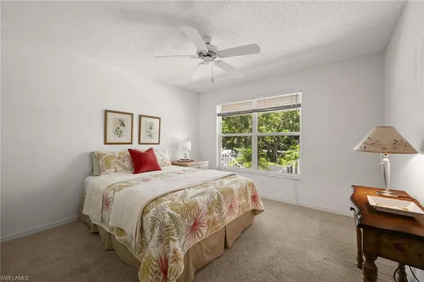 a bed room with a bed and a window