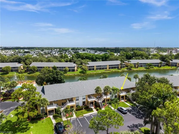 an aerial view of a house with a lake view
