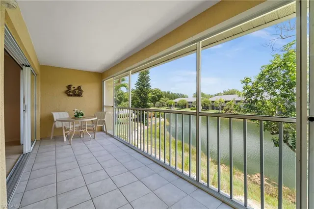 a view of a balcony with chairs
