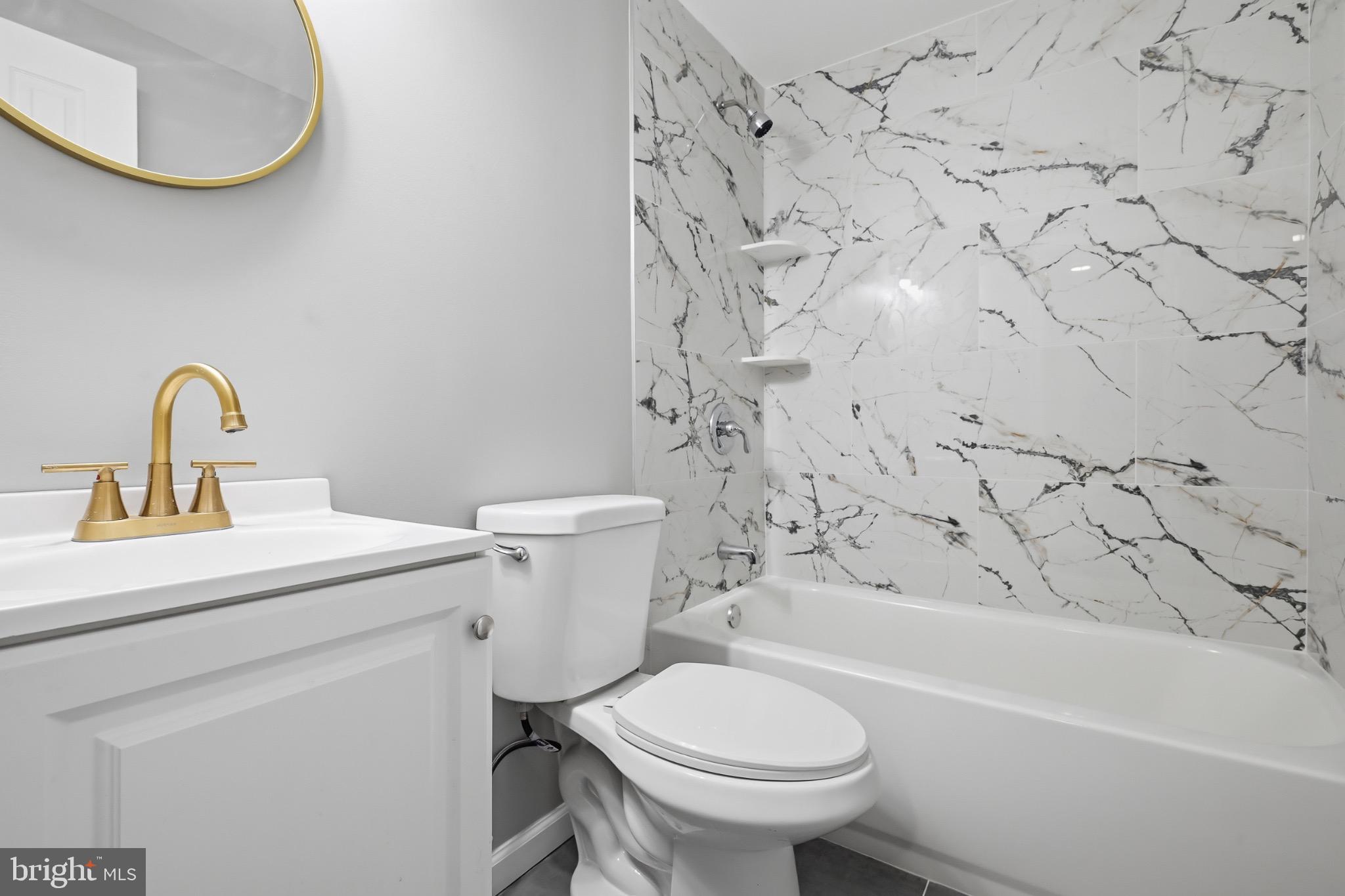 22 Raintree Drive New Castle, DE 19720 - Photo 11 of 29 a bathroom with a sink toilet and bathtub