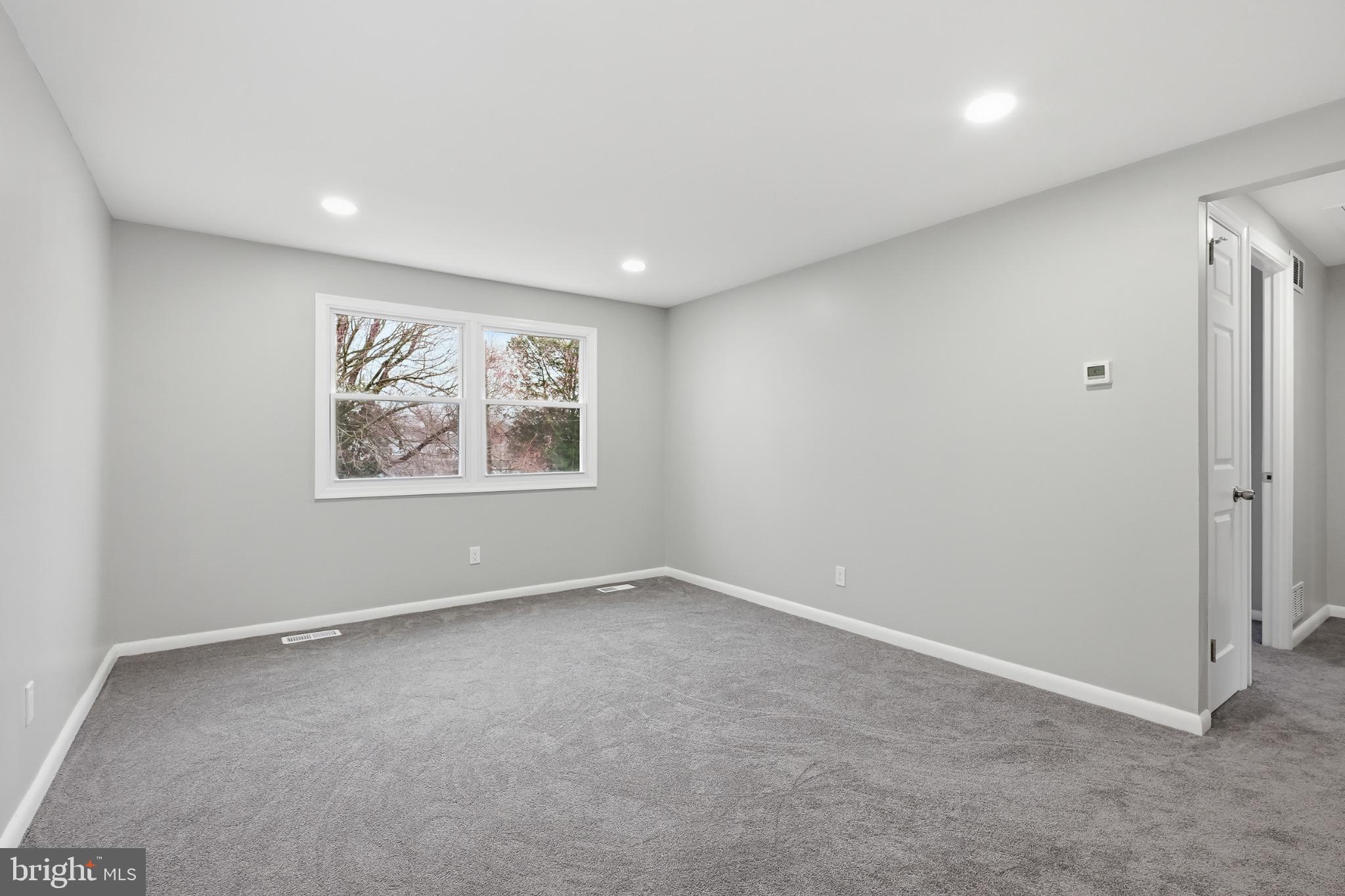 22 Raintree Drive New Castle, DE 19720 - Photo 12 of 29 an empty room with windows