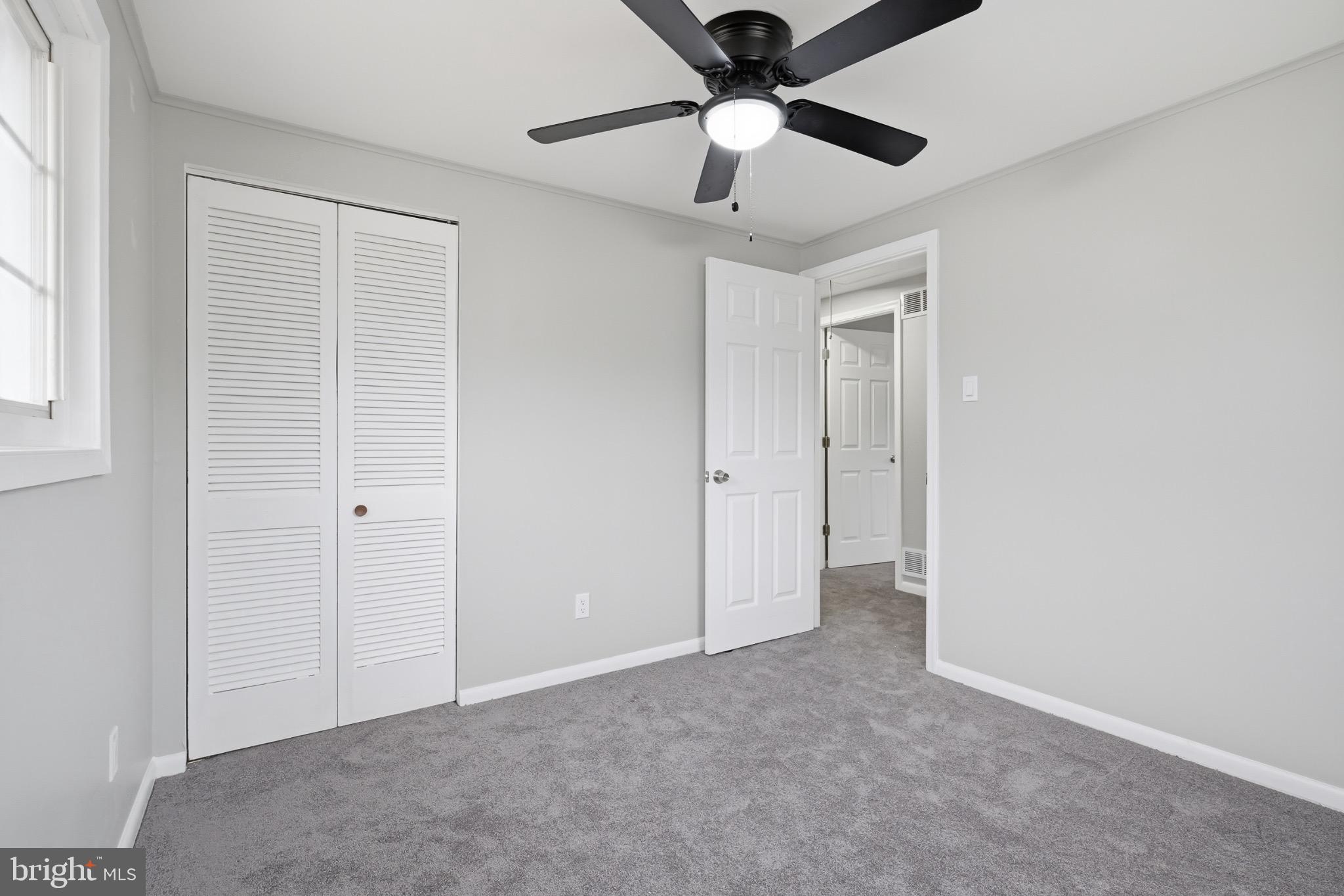 22 Raintree Drive New Castle, DE 19720 - Photo 23 of 29 an empty room with chandelier fan