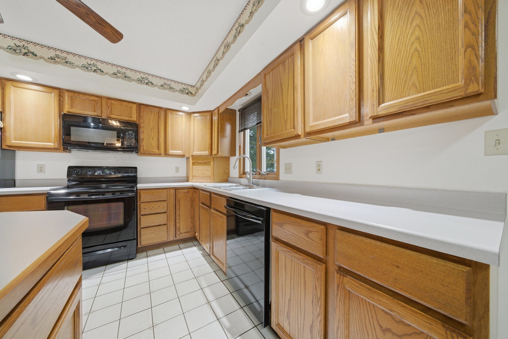 1016 North 7th Street Rochelle, IL 61068 - Photo 8 of 39 a kitchen with stainless steel appliances granite countertop a stove a sink and a microwave