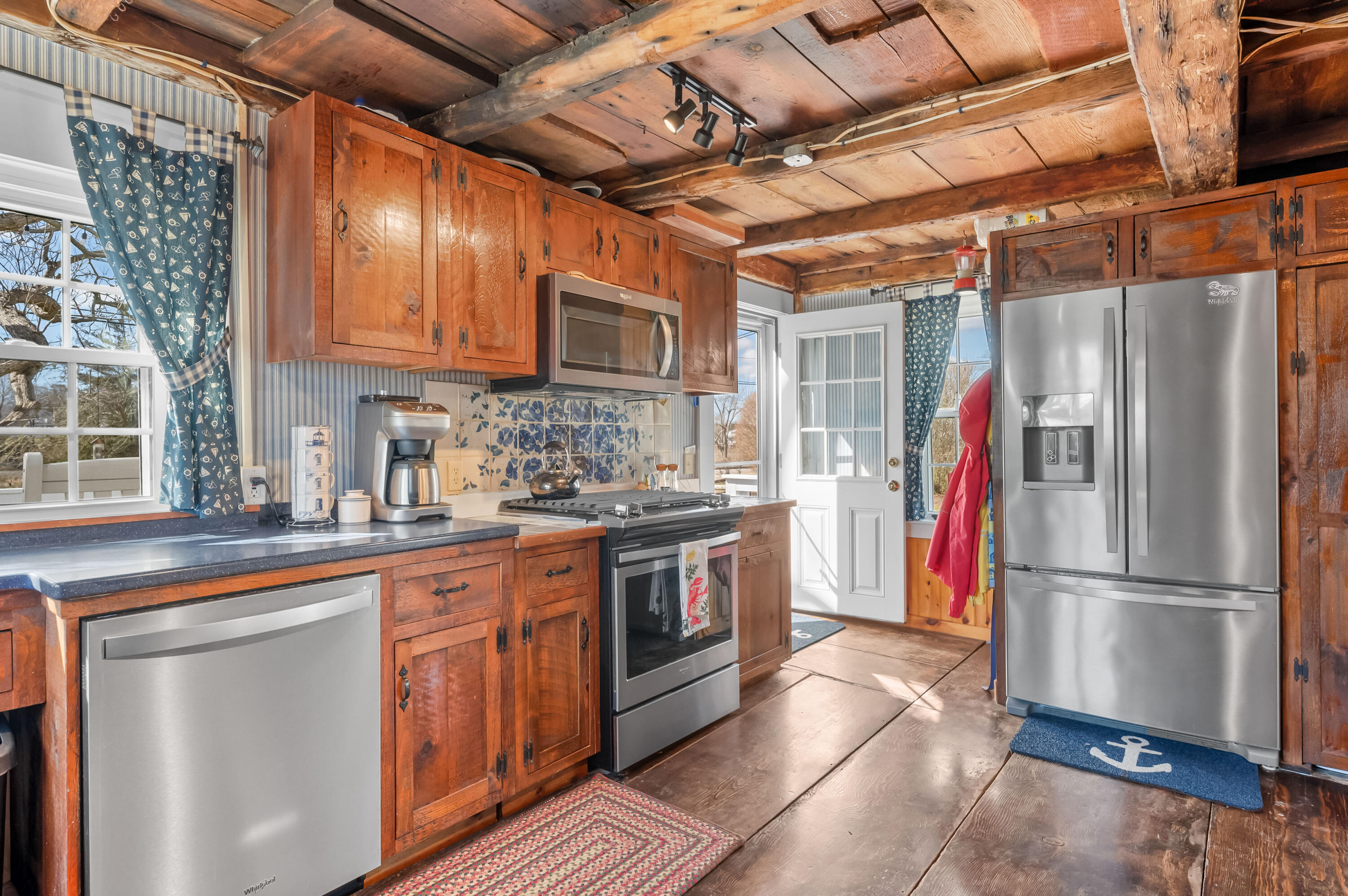 40 Commerce Road Barnstable, MA 02630 - Photo 15 of 43 a kitchen with stainless steel appliances granite countertop a refrigerator and a sink