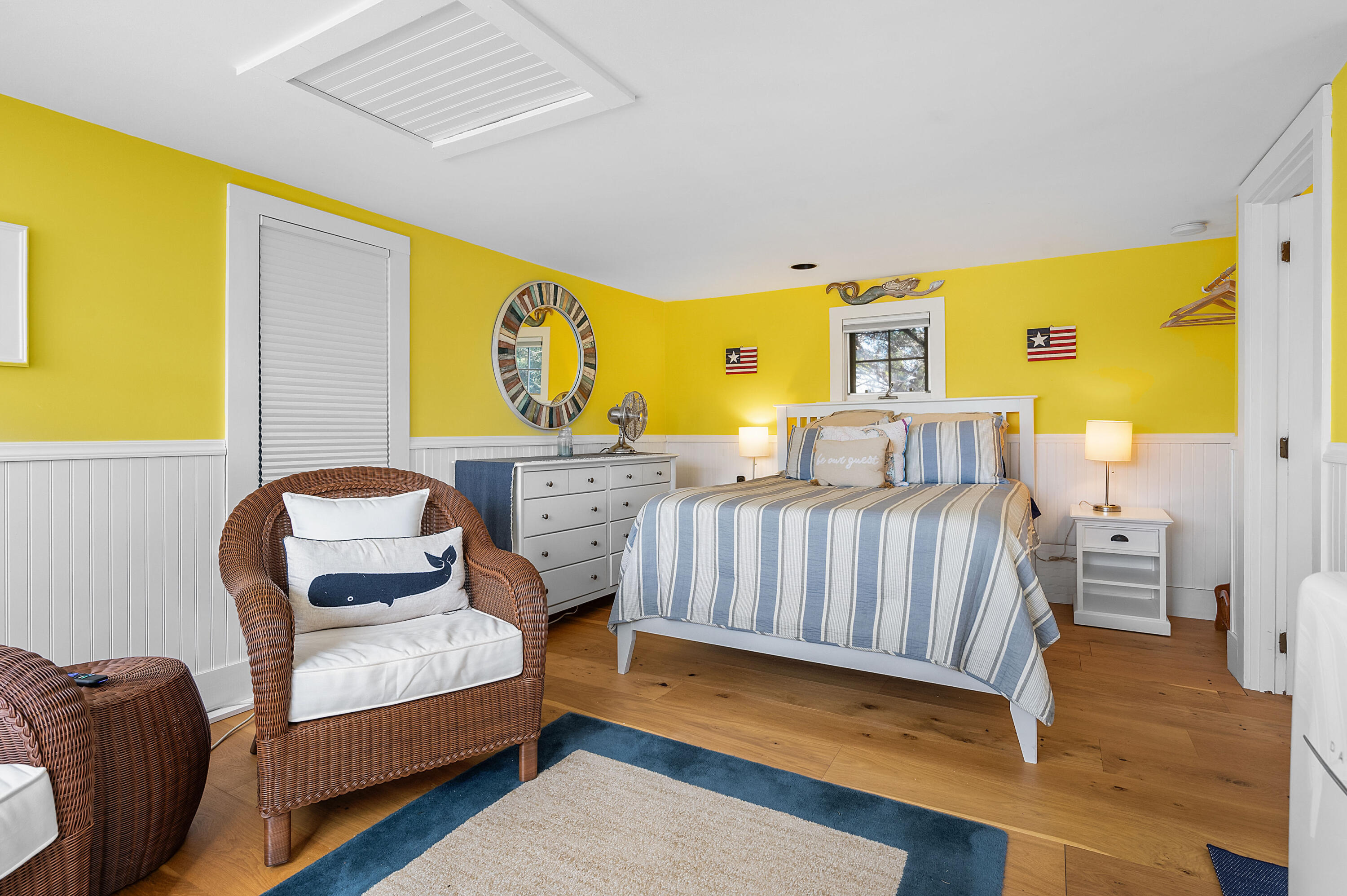 40 Commerce Road Barnstable, MA 02630 - Photo 23 of 43 a bedroom with a bed and wooden floor