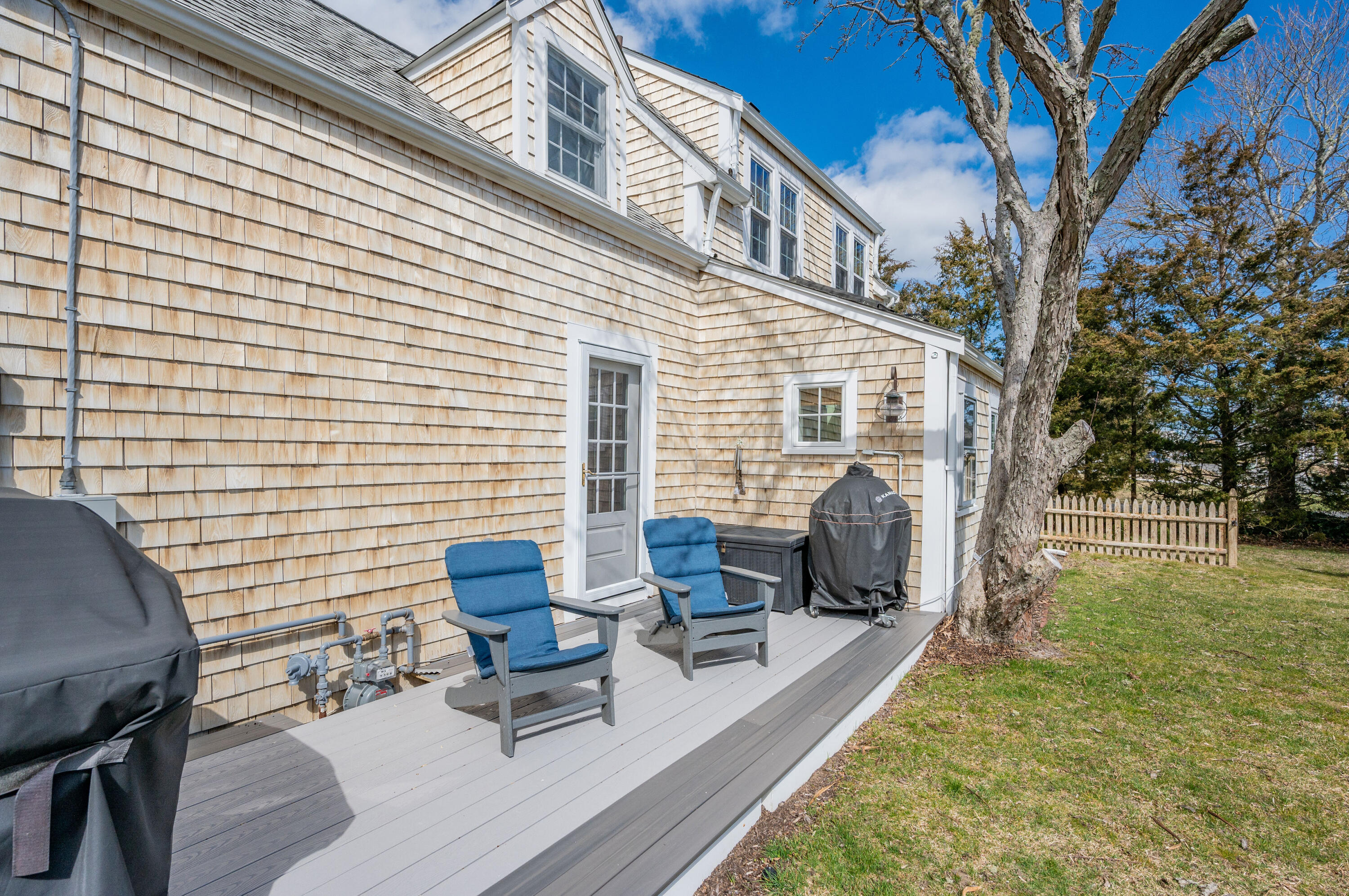 40 Commerce Road Barnstable, MA 02630 - Photo 28 of 43 a view of a patio with couches and a table