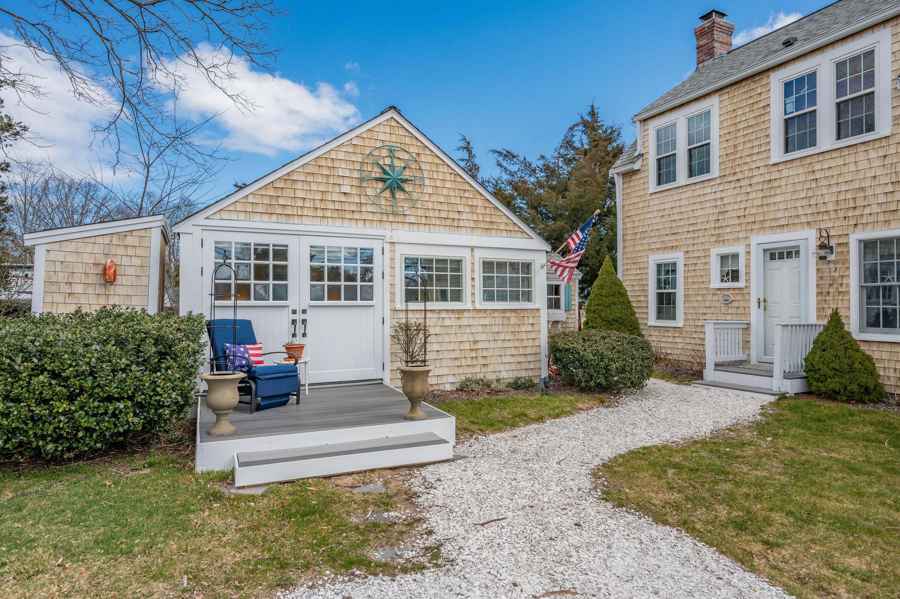 40 Commerce Road Barnstable, MA 02630 - Photo 32 of 43 a front view of a house with a yard