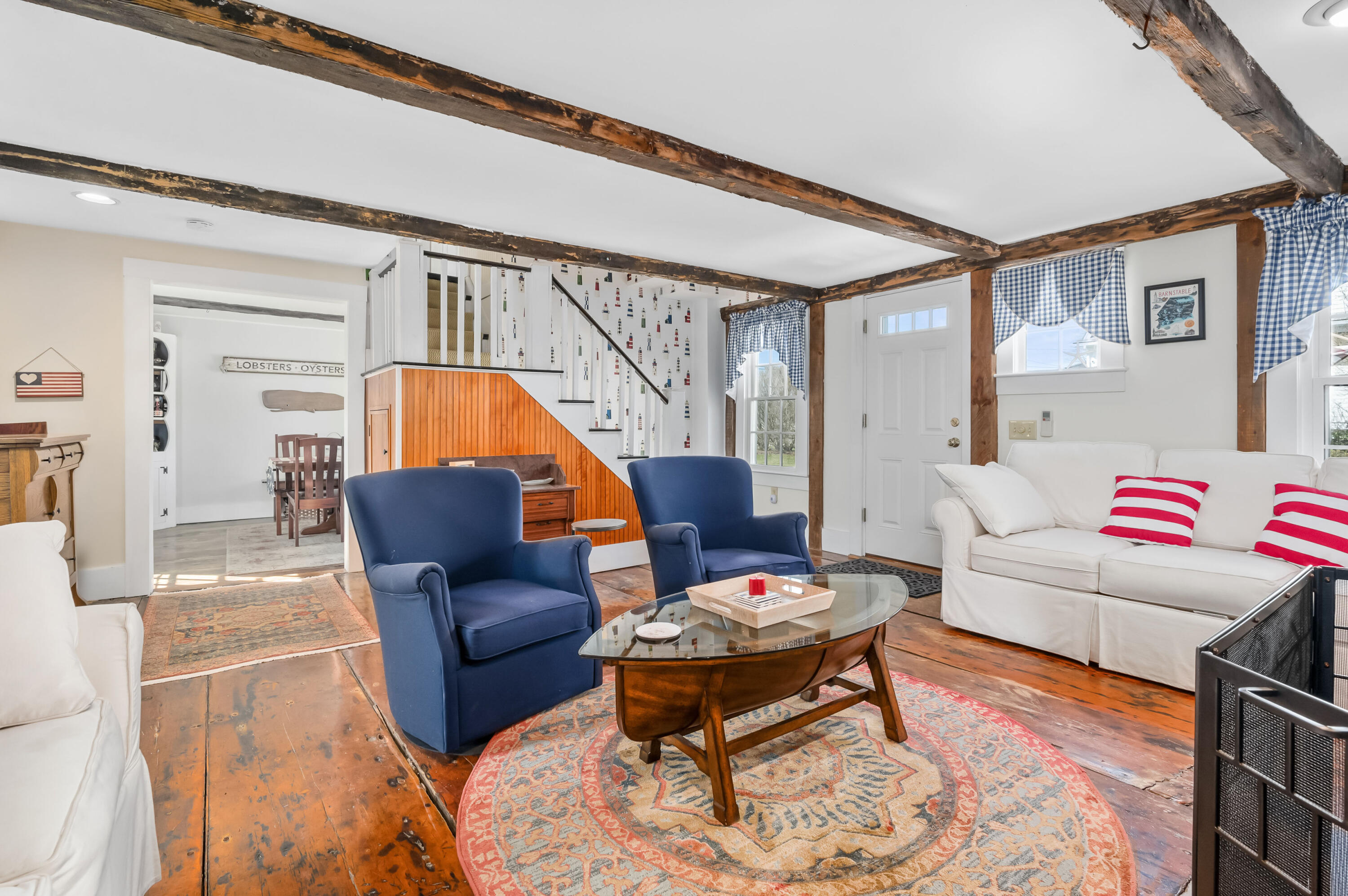 40 Commerce Road Barnstable, MA 02630 - Photo 6 of 43 a living room with furniture and a wooden floor
