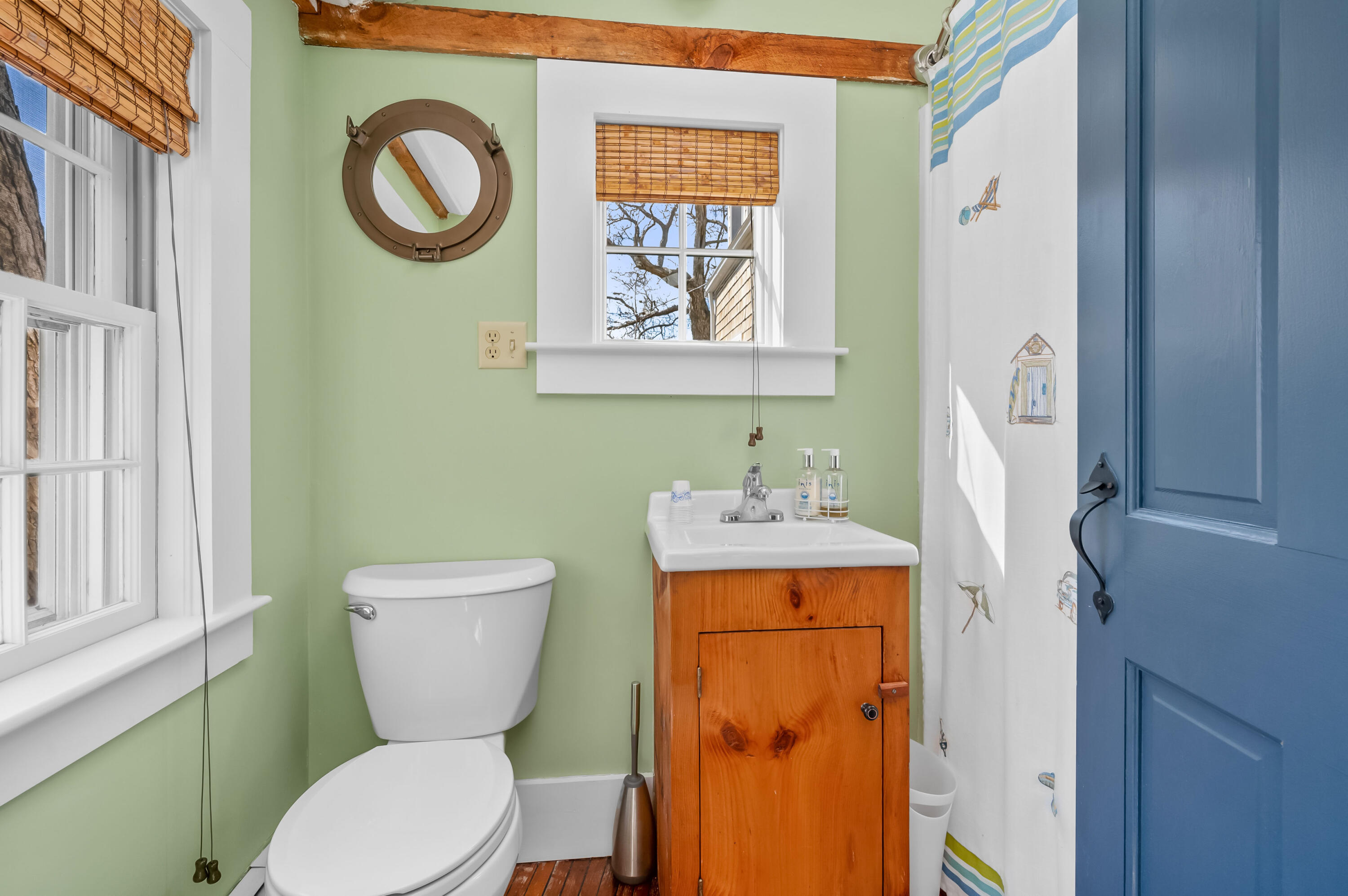 40 Commerce Road Barnstable, MA 02630 - Photo 8 of 43 a white toilet sitting next to a bathroom sink