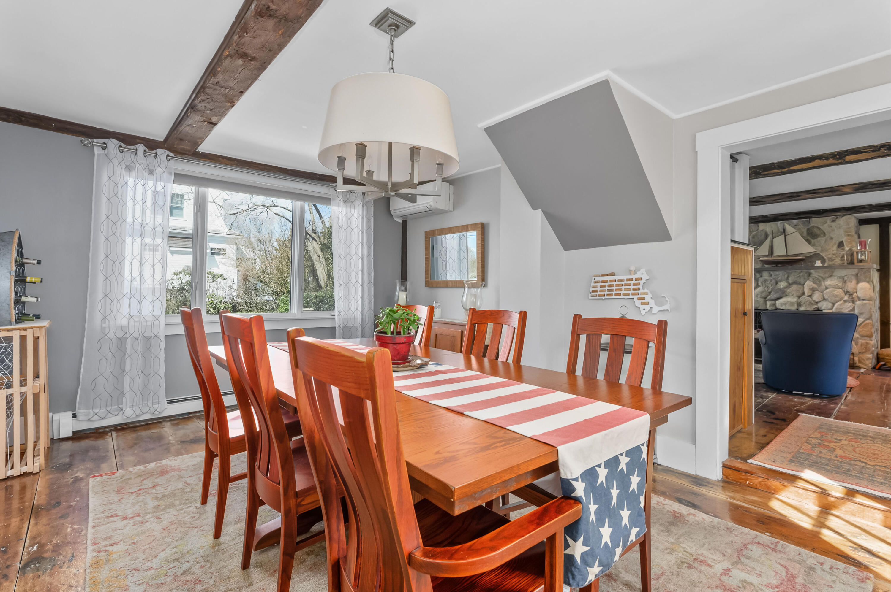 40 Commerce Road Barnstable, MA 02630 - Photo 10 of 43 a view of a dining room with furniture wooden floor and chandelier