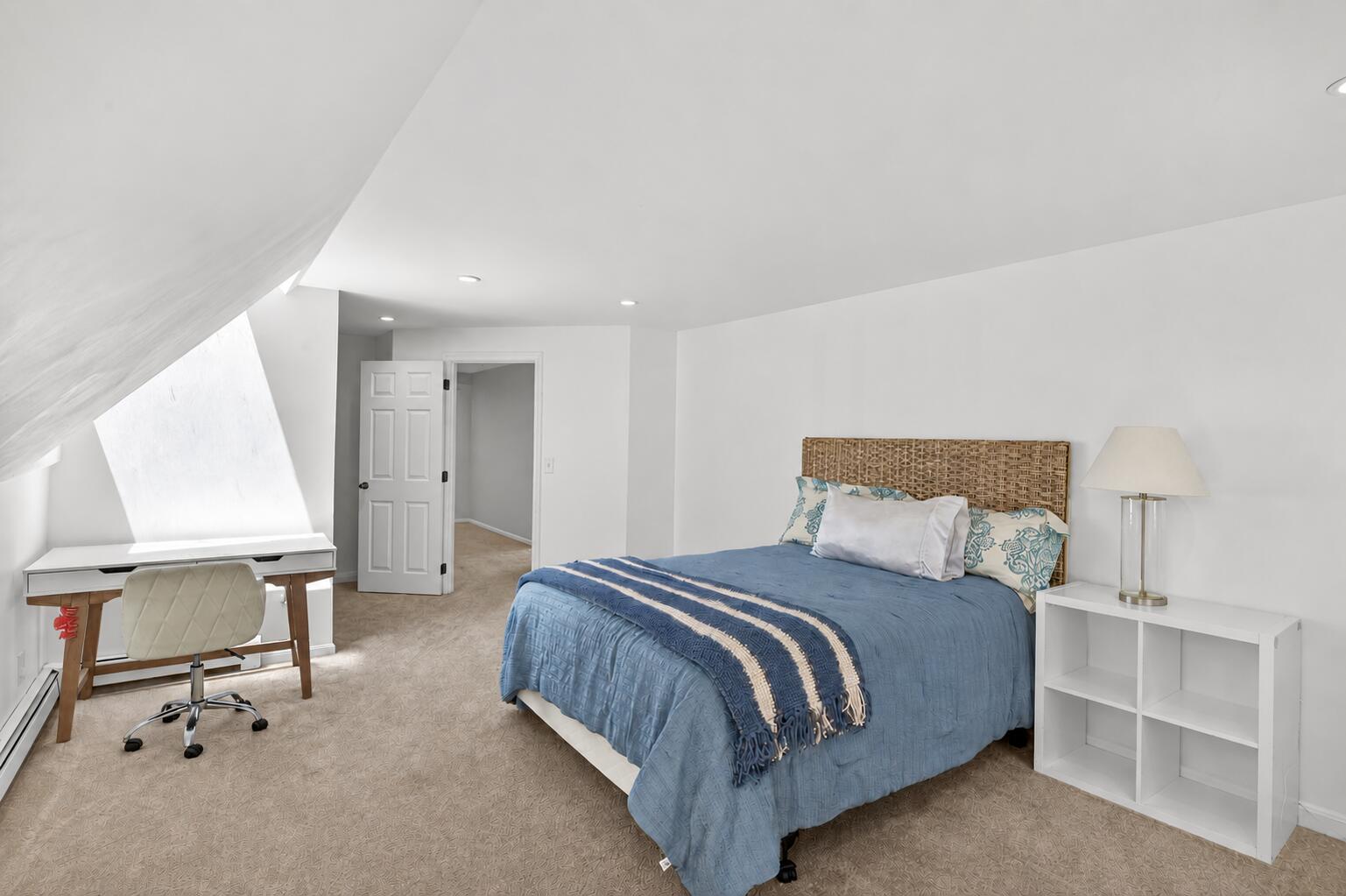12 Sarah Lawrence Road Sandwich, MA 02563 - Photo 29 of 54 a bedroom with a bed a desk and chair