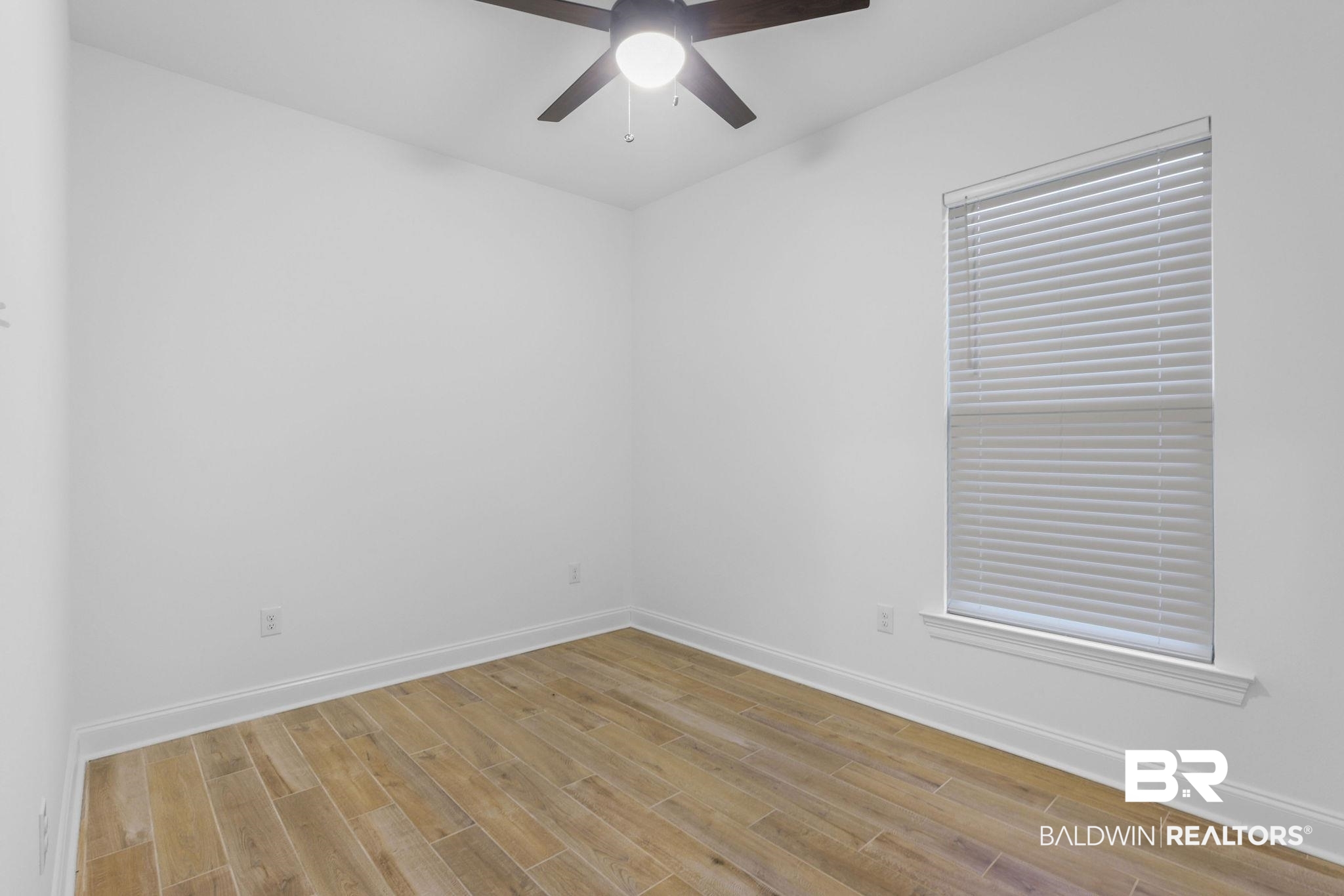 9855 Chipper Lane Foley, AL 36535 - Photo 20 of 48 Empty room featuring light hardwood / wood-style flooring and ceiling fan