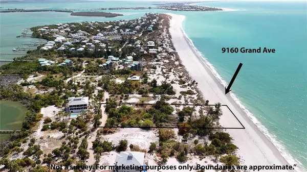 a balcony with glass top table and chairs