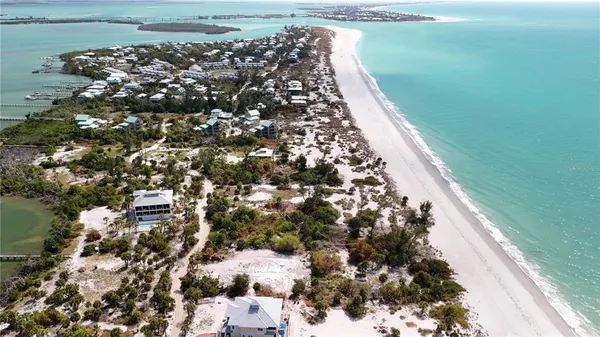 a view of a lake with boats next to a house