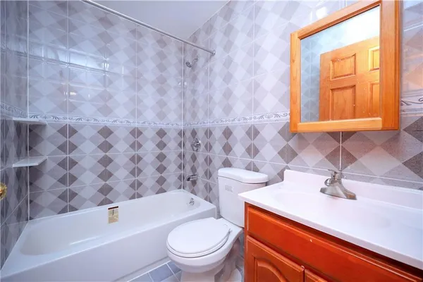 a bathroom with a sink a toilet and a bathtub