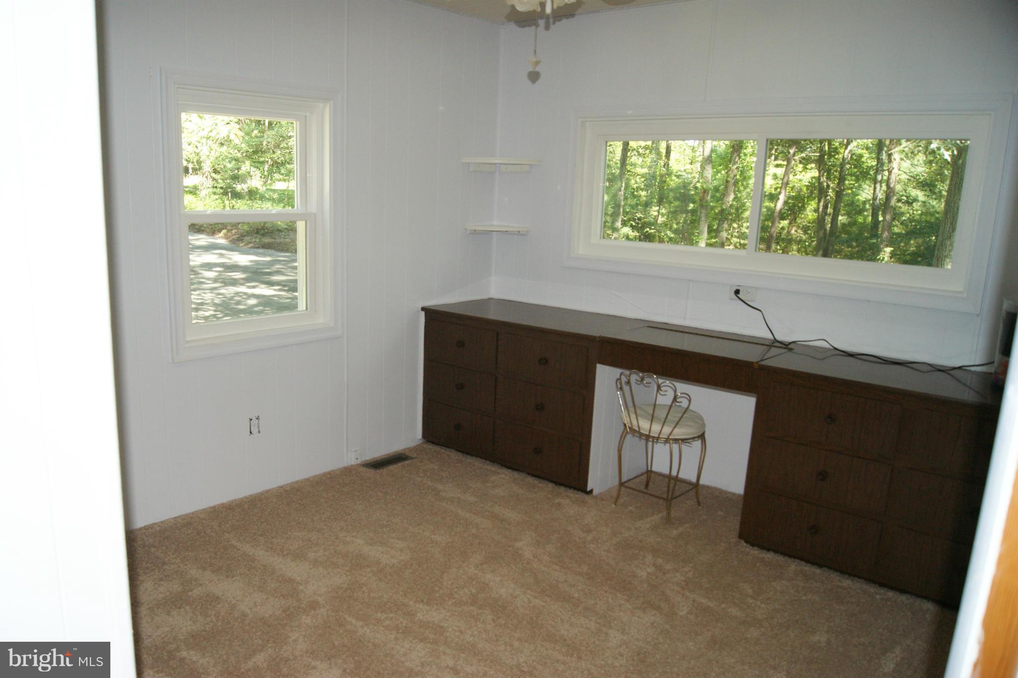 6805 Mackall Road St. Leonard, MD 20685 - Photo 11 of 30 a view of an empty room with a window