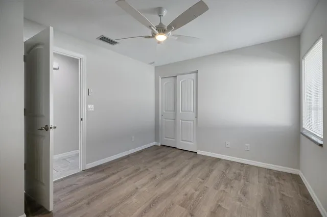 a bathroom with a granite countertop toilet a sink and bathtub