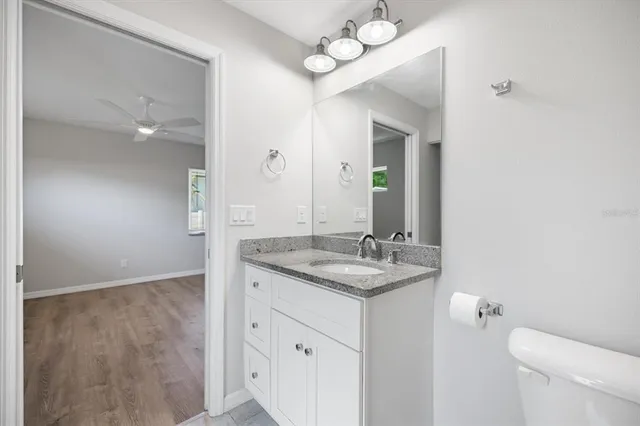 a bathroom with a glass shower door