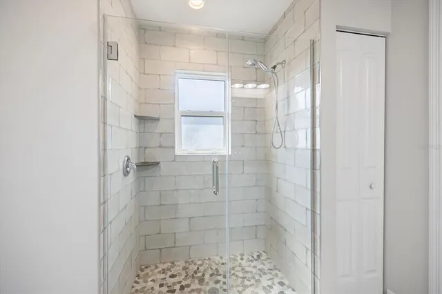 a view of room with window and lounge chair