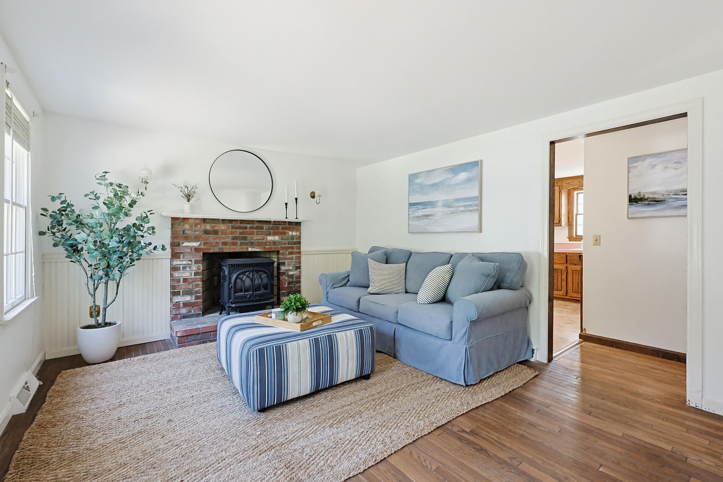 556 Cotuit Road Mashpee, MA 02649 - Photo 2 of 45 a living room with furniture and a fireplace