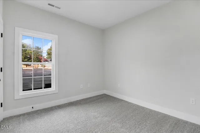 a view of empty room with windows