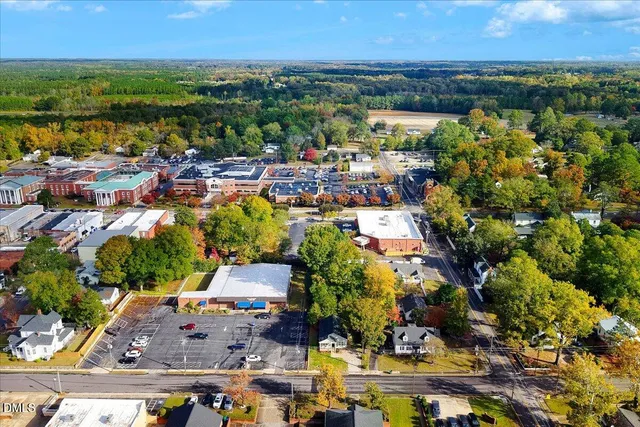 an aerial view of residential building and lake