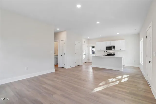a view of kitchen with wooden floor