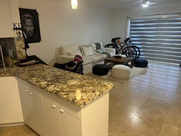 a kitchen with a sink and a stove top oven