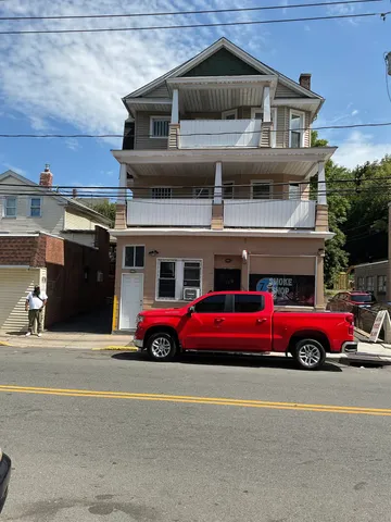 a front view of a house with parking space