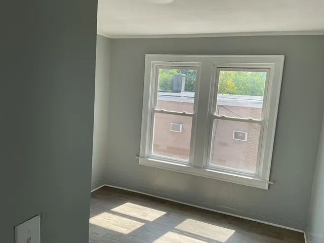 a view of an empty room and window
