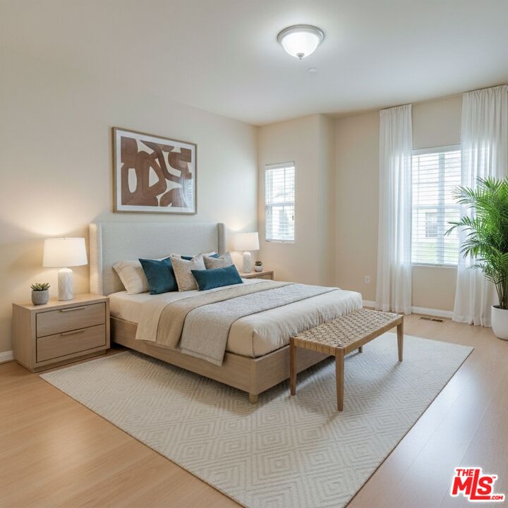 2155 Associated Road Fullerton, CA 92831 - Photo 15 of 47 a bedroom with a large bed and a couch